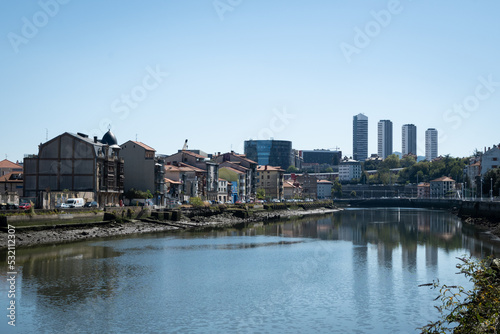 old buildings just out of the center of the city Bilbao. The structures alongside the nervion river are in an area called deustuko san pedro-erribera © drew