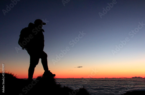 Silhouette of 1 Hiker in the Mt. Pulag Mountain with a Sea of Clouds	