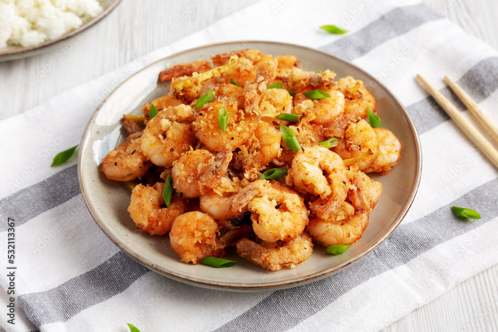 Homemade Crispy Salt and Pepper Shrimp with Scallions on a Plate, side view.