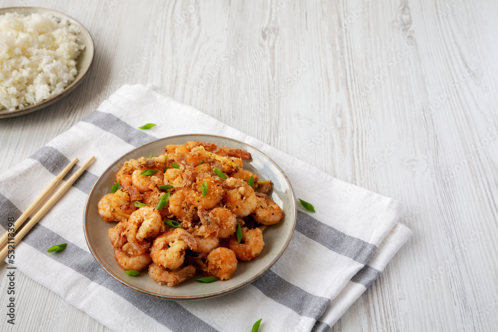 Homemade Crispy Salt and Pepper Shrimp with Scallions on a Plate, side view. Copy space.