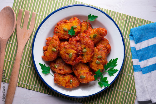 Pumpkin fritters typical of Spain. Traditional recipe made with egg and pumpkin.