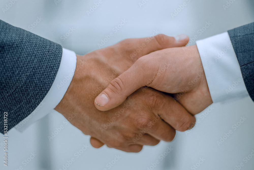 close up.handshake of business people on blurred background close up.handshake of business people on blurred background