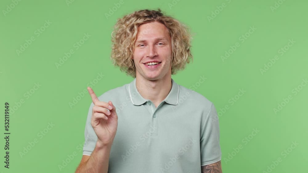 Young confident caucasian blond man 20s wear blue t-shirt look camera pointing fingers himself ask say who me no thanks i do not need it isolated on plain pastel light green background studio portrait Young confident caucasian blond man 20s wear blue t-shirt look camera pointing fingers himself ask say who me no thanks i do not need it isolated on plain pastel light green background studio portrait