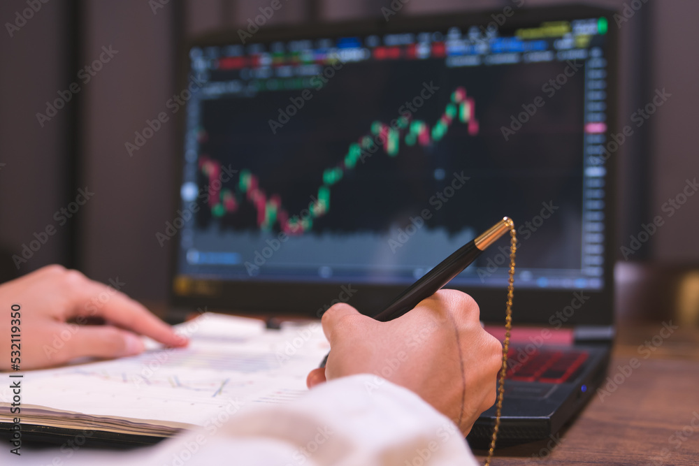 Stock analysts are checking trading charts for stock growth to analyze investment risks, Find financial management information from the graph to increase investment stability. Stock analysts are checking trading charts for stock growth to analyze investment risks, Find financial management information from the graph to increase investment stability.