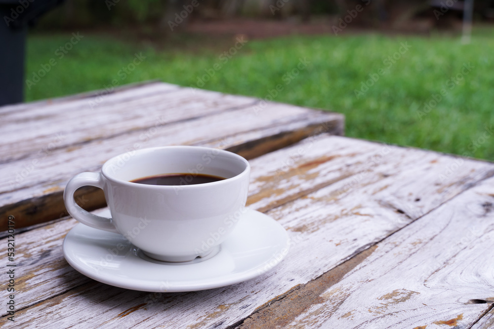 hot americano coffee on old wooden table. hot americano coffee on old wooden table.