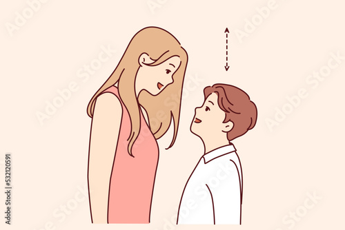 Couple with different height look in eyes. Tall woman and short man contrasting height. Relationship problem concept. Vector illustration. 