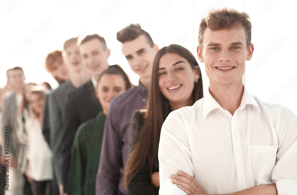 image of a group of young people standing in a queue image of a group of young people standing in a queue