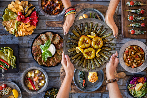Grape leaves and bell peppers stuffed with rice named dolma and yaprak sarması  or dolmades  photo