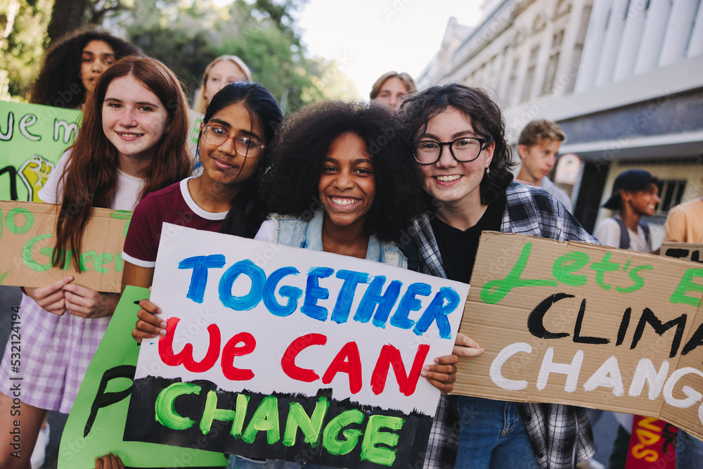 Happy teenage girls joining the global climate strike - obrazy, fototapety, plakaty 