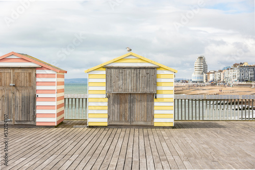 colourful pier huts on hasting's pier, copy space © © Raymond Orton