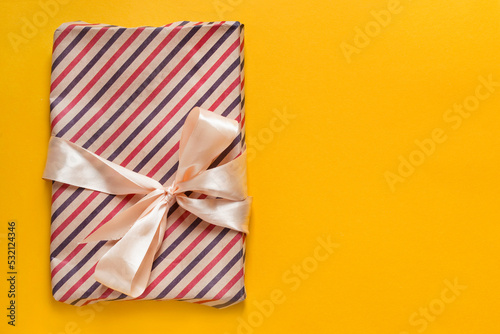Gift package on yellow background