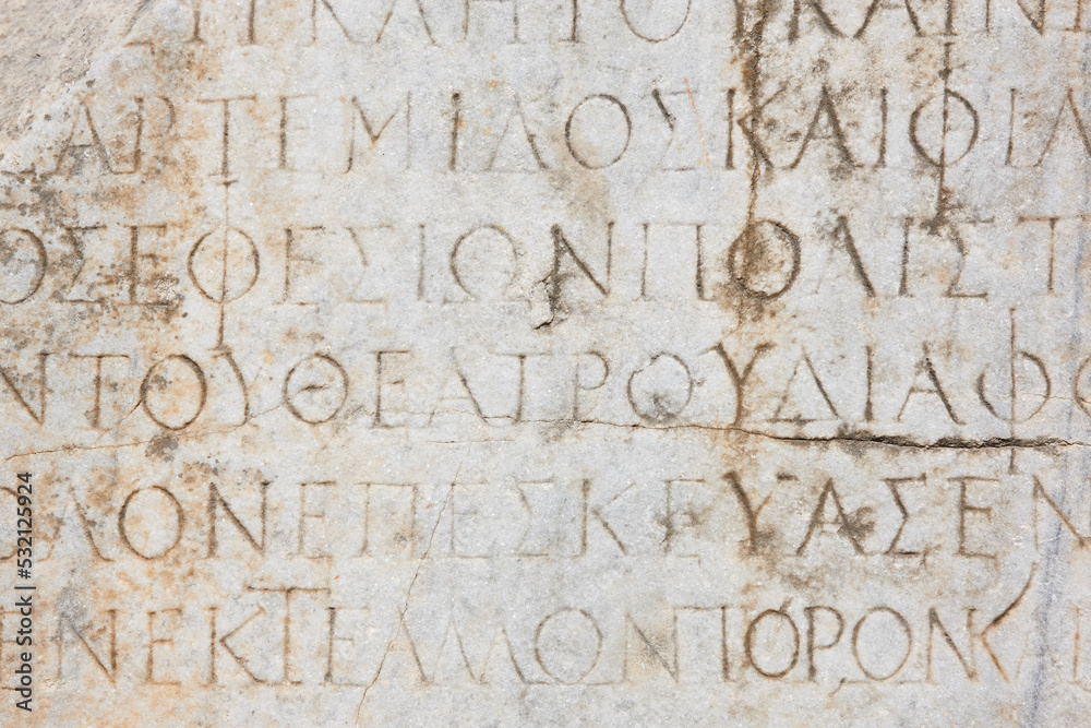 Ancient greek text marble carving. Ephesus historical site. Turkey Ancient greek text marble carving. Ephesus historical site. Turkey