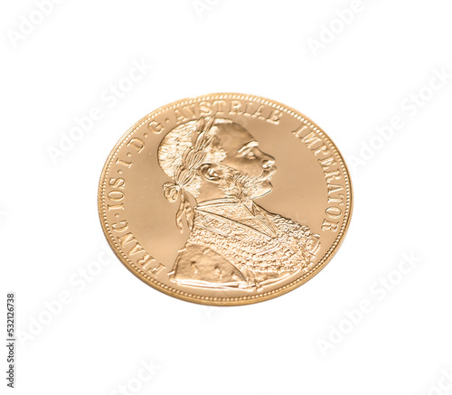 four austrian ducats on a white background. investing in gold bullion coins
