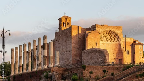Time lapse video with moving clouds at sunrise above the Domus Aurea, built by Emperor Nero in Rome, in the Roman Forum. photo