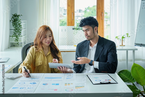 Obraz na plátně A portrait of a female business owner consulting a male salesperson to devise a