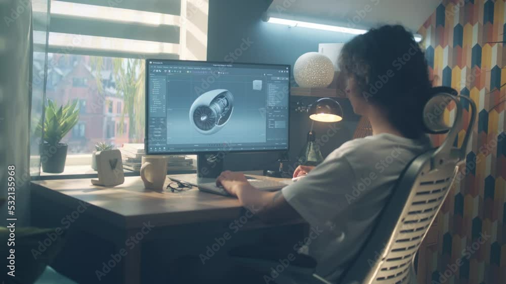 Male young engineer using pc with professional program and creating 3D prototype of airplane turbine while working remotely at home office