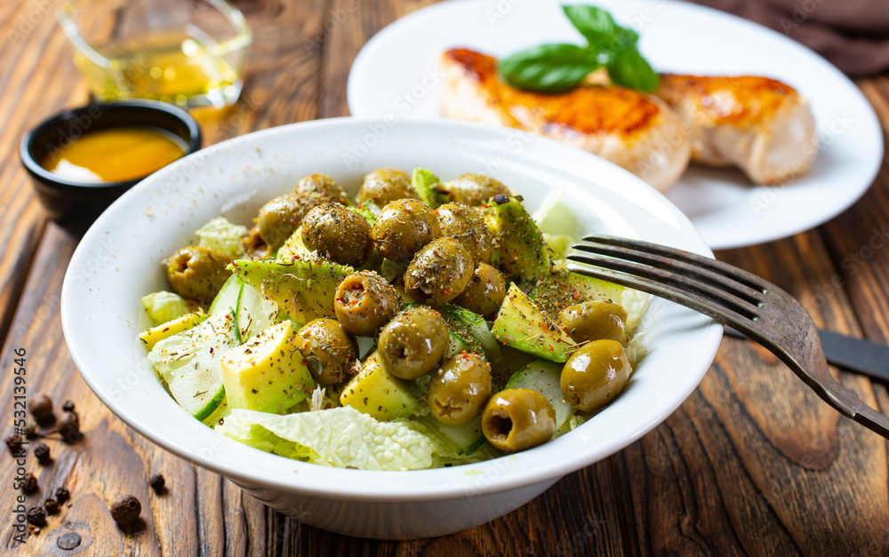Greek salad. Fresh vegetable salad of cucumbers, tomatoes, olives, onion Greek salad. Fresh vegetable salad of cucumbers, tomatoes, olives, onion