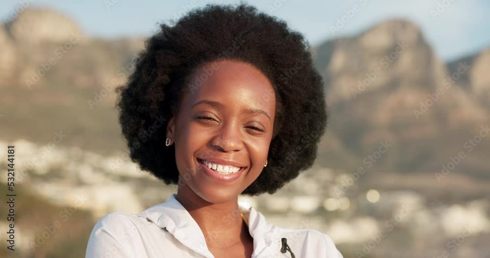 Happy, smile and black woman in nature with happiness laughing in the summer sun. Portrait of a person smiling from Kenya with natural hair relax in the sunshine with a outdoor mountain background Happy, smile and black woman in nature with happiness laughing in the summer sun. Portrait of a person smiling from Kenya with natural hair relax in the sunshine with a outdoor mountain background