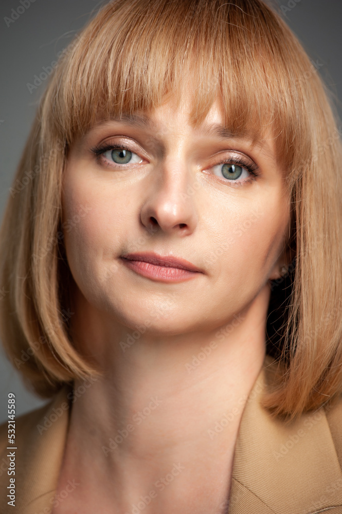 Beautiful blonde businesswoman portrait on background Beautiful blonde businesswoman portrait on background