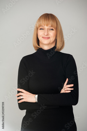 Close up blonde woman portrait with hands on background
