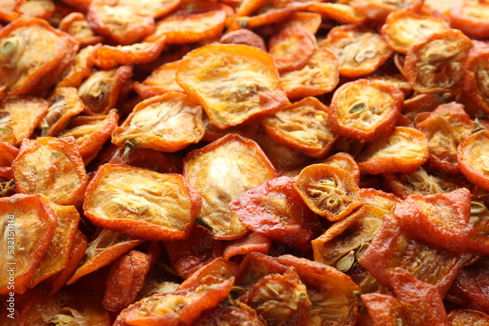 Cut dried kumquat fruits as background, closeup Cut dried kumquat fruits as background, closeup