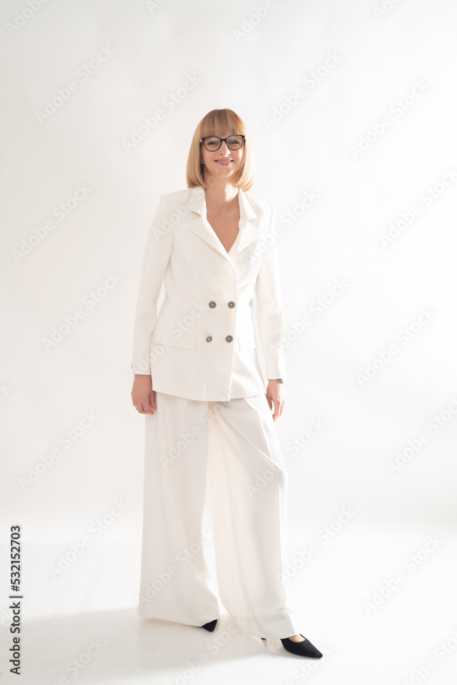 Portrait of blonde businesswoman confident on grey background Portrait of blonde businesswoman confident on grey background