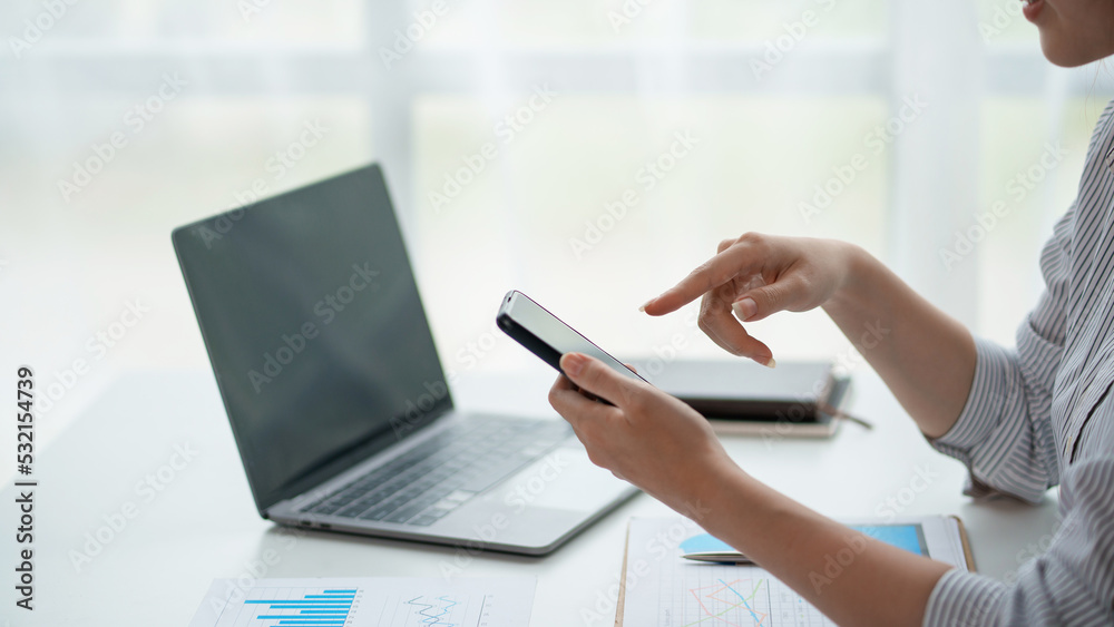Close-up of a woman using a smartphone to work on various social media applications. including mobile transactions and LINE messaging and other business information via LINE. Close-up of a woman using a smartphone to work on various social media applications. including mobile transactions and LINE messaging and other business information via LINE.