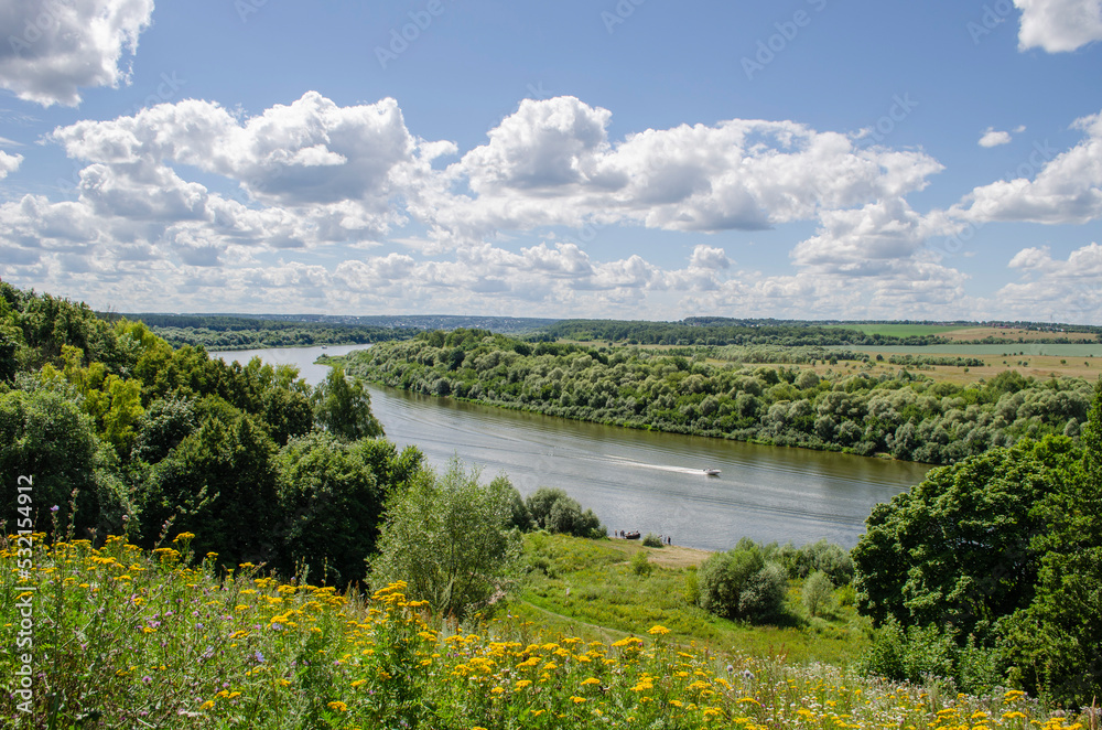 View of the river from the hill on a sunny summer day