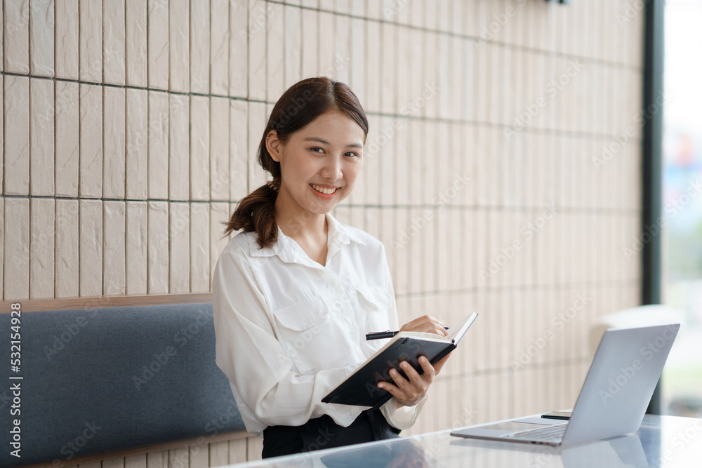 Attractive and beautiful Asian women are reading book and working in cafe at their leisure and enjoying reading on vacation. Attractive and beautiful Asian women are reading book and working in cafe at their leisure and enjoying reading on vacation.