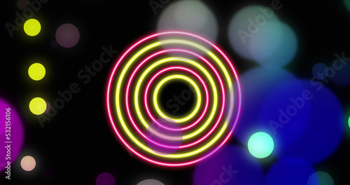 Images of moving lights and colorful shapes over black background