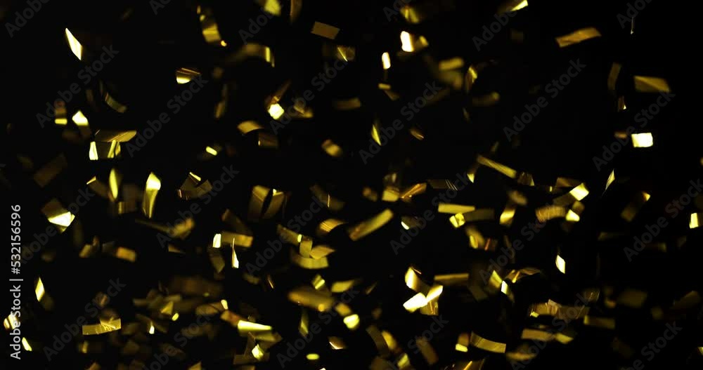 Falling foil confetti with gold glitter on a black background.