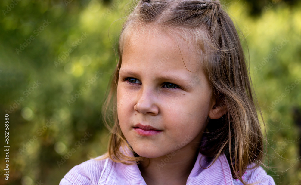 Little girl is resting in the park. Copy space. Portrait of a pretty cute girl close-up. Little girl is resting in the park. Copy space. Portrait of a pretty cute girl close-up.