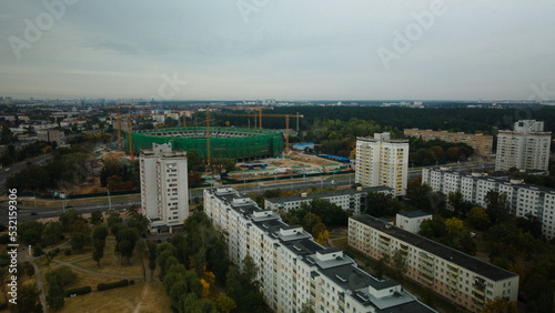 Multi-storey buildings with infrastructure. Densely populated urban area. Overcast weather. Aerial photography.