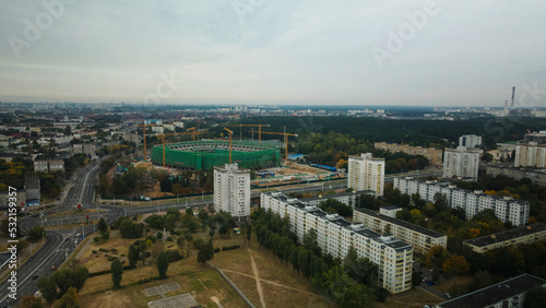 Building a stadium in a big city. Construction site among urban areas. Aerial photography. © f2014vad