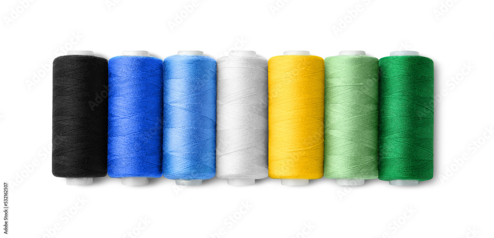 Set of different colorful sewing threads on white background, top view Set of different colorful sewing threads on white background, top view