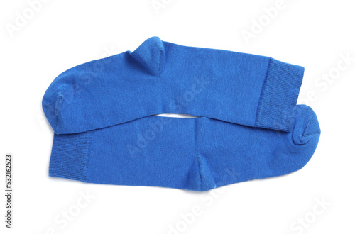 Pair of blue socks on white background, top view