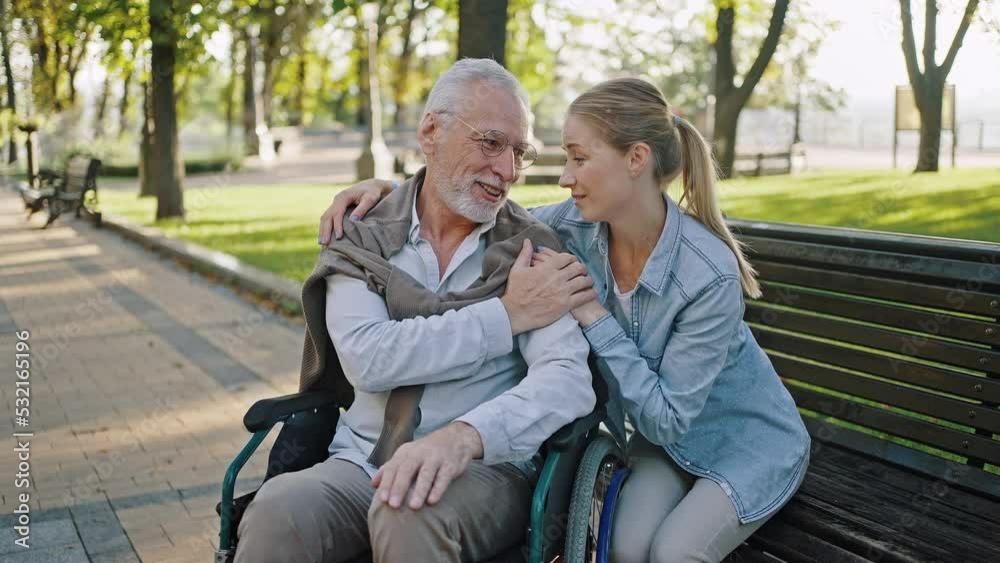 Daughter hugs senior father having deep conversations Daughter hugs senior father having deep conversations