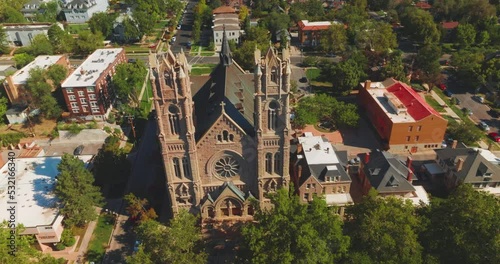 Flying around the gorgeous historic landmark in salt Lake City, Utah, USA. Gothic building of Cathedral of Madeleine from aerial perspective. photo