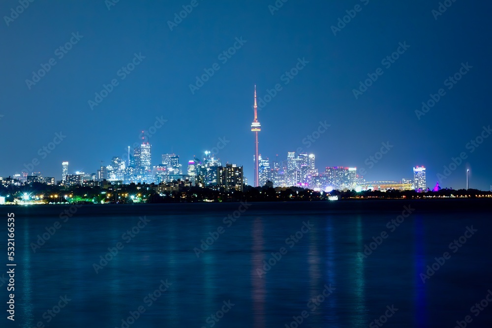 Night Shot of Toronto Skyline with Water reflecting on Lake Ontario