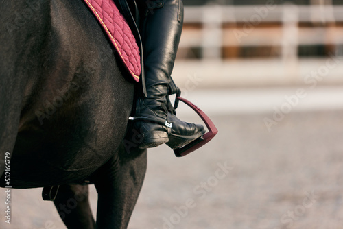 Fotografiet Closeup rider's foot in the stirrup