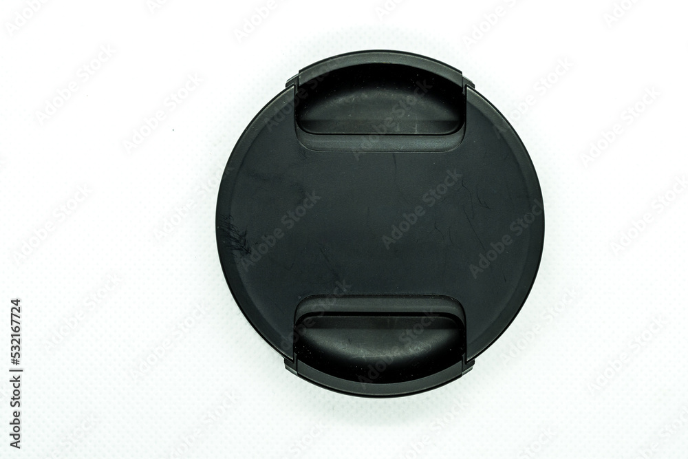 Black lens cap of a lens isolated on white background Black lens cap of a lens isolated on white background