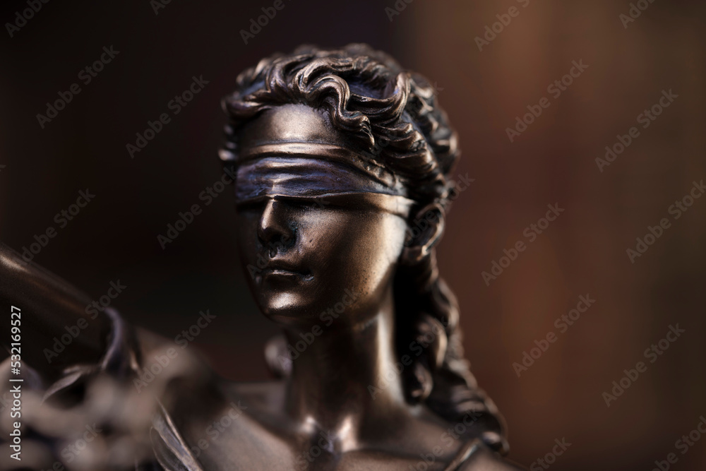 Law and justice concept. Justice symbol - Themis sculpture on gray background.