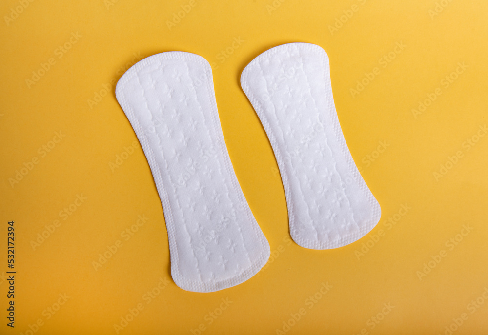 Menstrual pads on orange background Menstrual pads on orange background