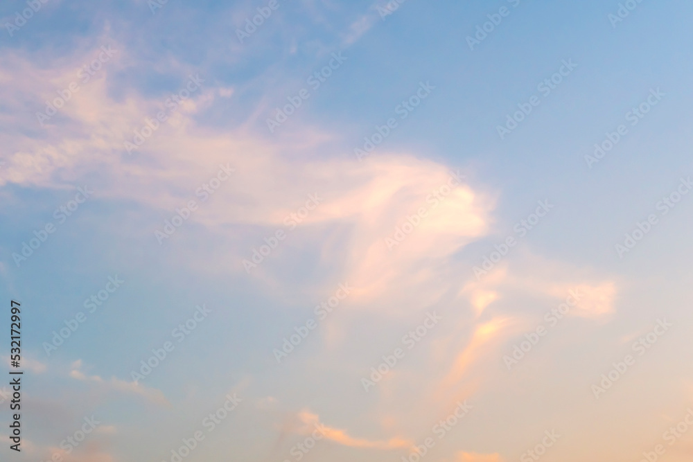 White clouds on morning sky. May be associated with human or angel head shape