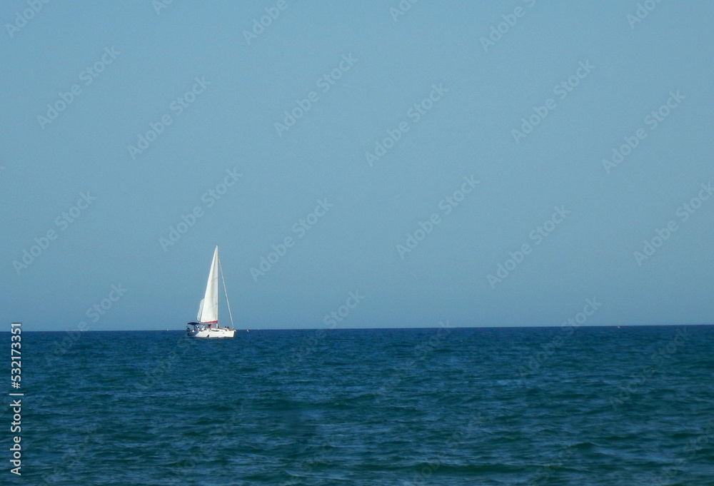 Sailboat on the blue horizon