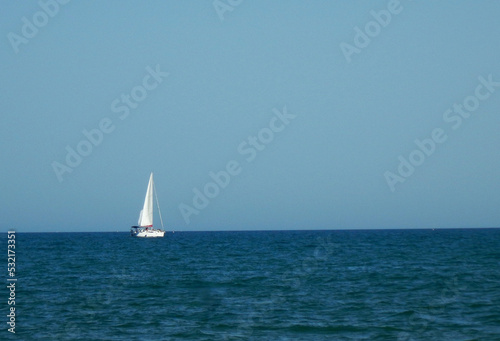Sailboat on the blue horizon
