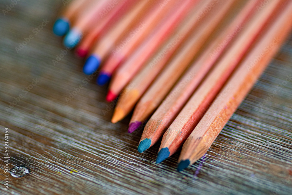 Selective focus. Several colored pencils placed on the table. Abstract Selective focus. Several colored pencils placed on the table. Abstract