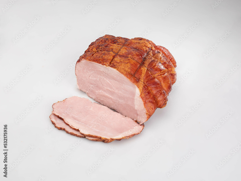 Smoked ham - in one piece and sliced, isolated on a white background. Polish cold cuts, a packshot photo. Smoked ham - in one piece and sliced, isolated on a white background. Polish cold cuts, a packshot photo.