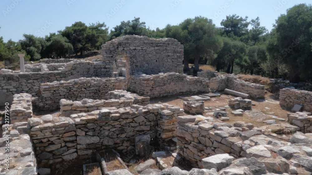 Ruins of ancient church surrounding pine trees on hill, summer daylight, archeological site of Aliki, Thassos, Greece. Ruins of ancient church surrounding pine trees on hill, summer daylight, archeological site of Aliki, Thassos, Greece.