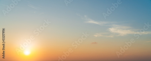 sunset sky in the evening with colorful orange sunlight clouds on sundown golden hour